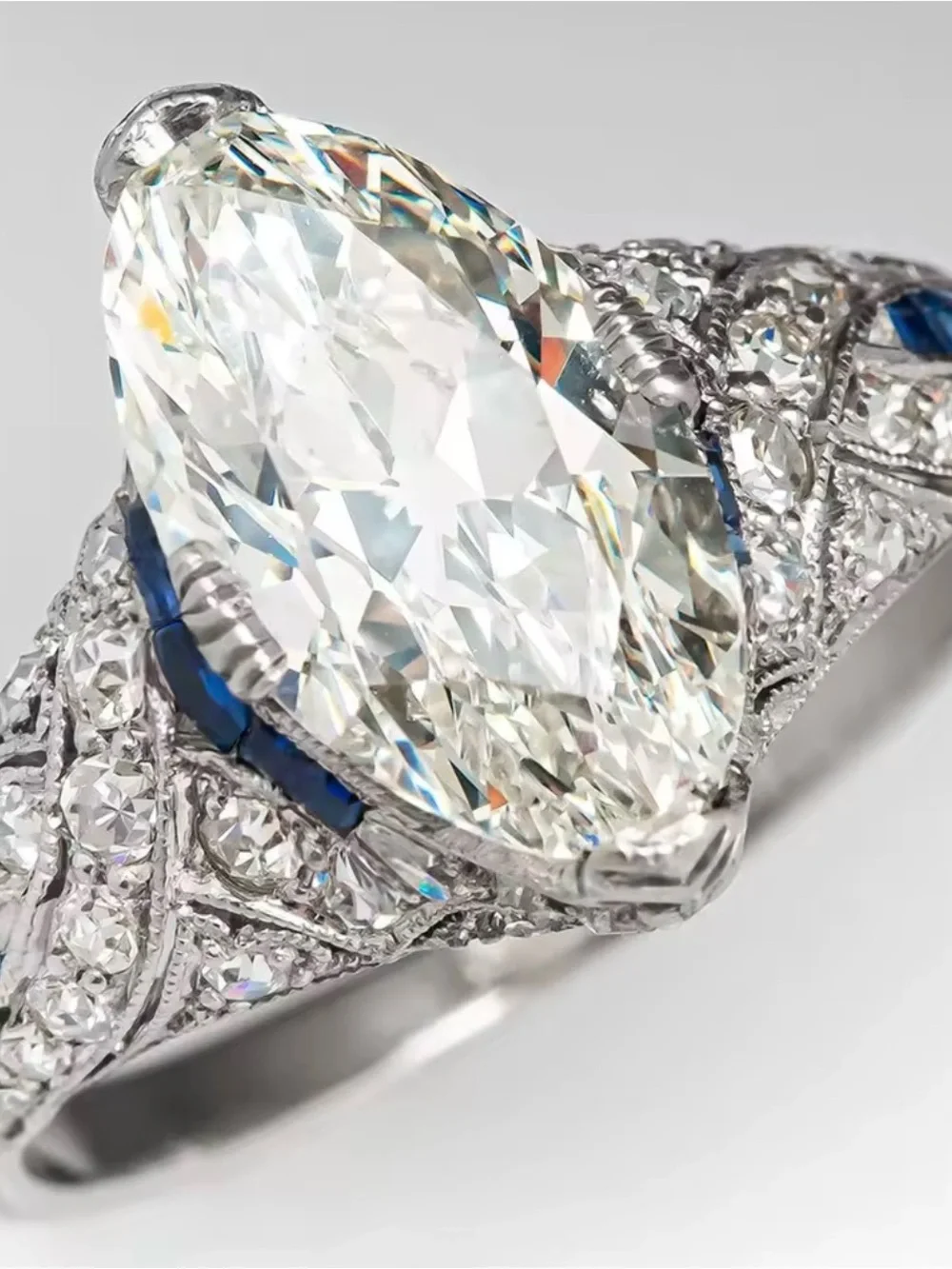Vintage-Style White Diamond Navette Ring with Blue Accents